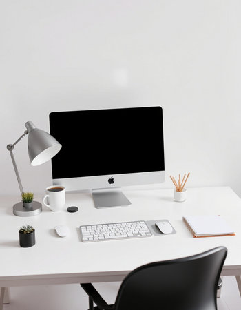 Modern workplace with computer, supplies and coffee cup on white table.の写真素材