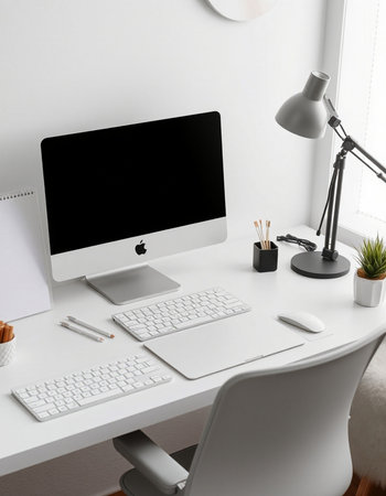 Workplace with computer, lamp and stationery on table in officeの写真素材