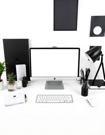 Modern workspace with blank screen computer monitor, stationery and accessories on white backgroundの写真素材