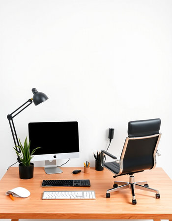 Workplace with computer, mouse, keyboard and lamp on the tableの写真素材