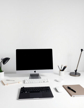 workplace with computer, stationery and coffee cup isolated on whiteの写真素材