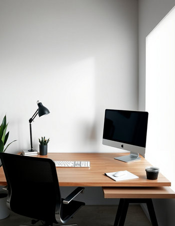 Interior of modern office with white walls, concrete floor, computer table with black chairs and plant.の写真素材