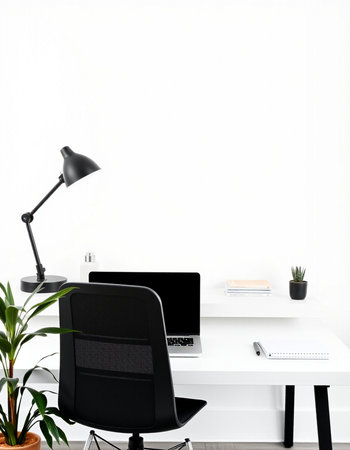 Interior of a modern office with a white wall and a computerの写真素材