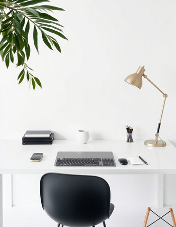 Front view of modern workplace with blank white wall, coffee cup, laptop and other items. Mock upの写真素材