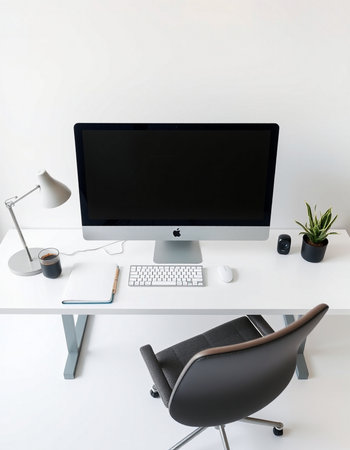 workplace with computer, chair, lamp and coffee cup in modern officeの写真素材