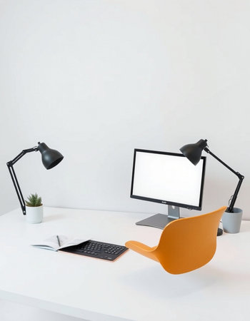 Modern office desk with computer, supplies and copy space on the wallの写真素材