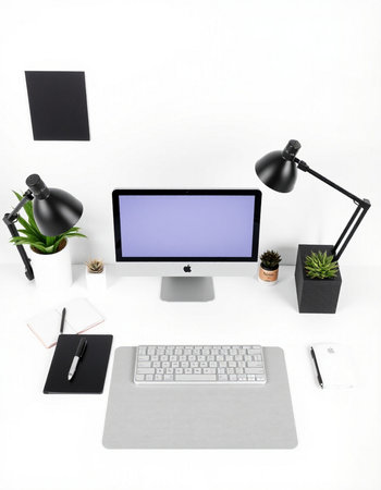 Modern workspace with blank screen computer, supplies and coffee cup on white backgroundの写真素材