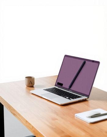 Laptop and coffee cup on wooden table with white wall background.の写真素材