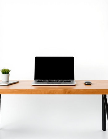Laptop with blank screen on wooden desk isolated on white background.の写真素材