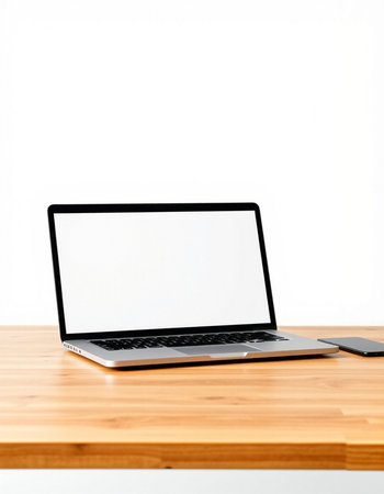Laptop computer with blank screen on wooden table isolated on white background