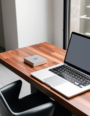laptop on wooden table in modern office