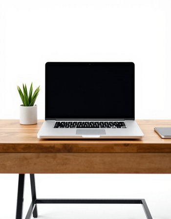Laptop with blank screen on wooden desk isolated on white background.の写真素材