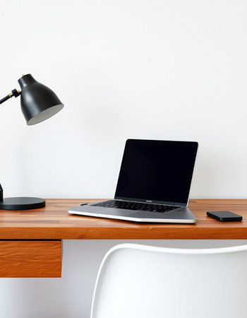 Laptop and lamp on a wooden table. 3d rendering.の写真素材
