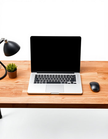 Laptop with blank screen on wooden desk isolated on white background.の写真素材