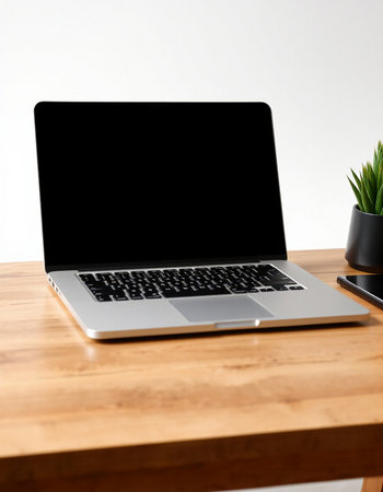 Laptop with blank screen on wooden table. Mockup for designの写真素材