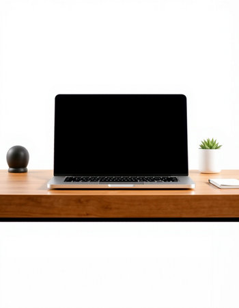 Laptop computer with blank screen on wood desk isolated on white backgroundの写真素材