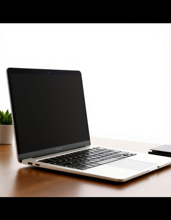 Laptop computer on wood table and white wall background, stock photo