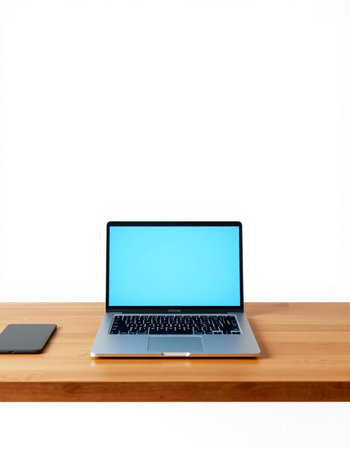 Laptop with blank screen on wood table isolated on white background.