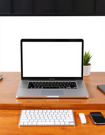 Laptop computer with blank screen on wooden table and white background.の写真素材