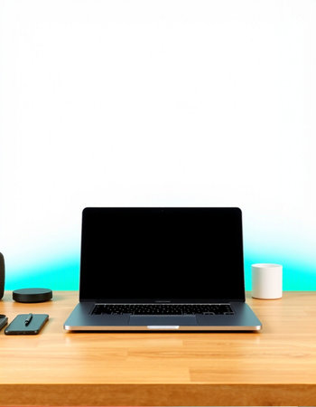 Laptop with blank screen on wooden desk with coffee cup and mouseの写真素材