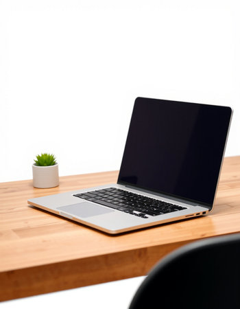 Laptop with blank screen on a wooden table, isolated on white background