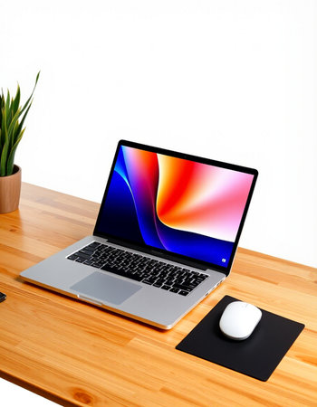 Laptop and mouse on a wooden table isolated on a white background