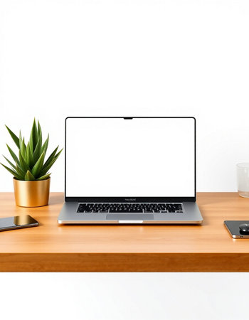 Laptop with blank screen on wooden table and white wall background.