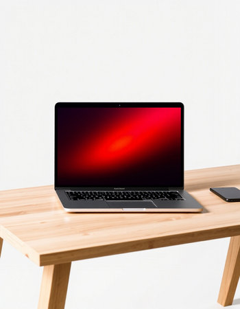 Laptop on wooden table isolated on white background.の写真素材