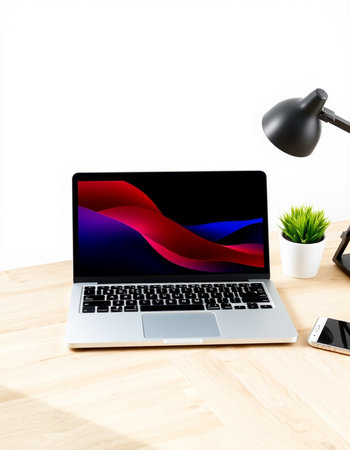 Laptop with red and blue graph on screen on wooden desk, stock photo