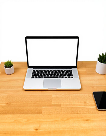 Laptop with blank screen on wooden desk isolated on white background.