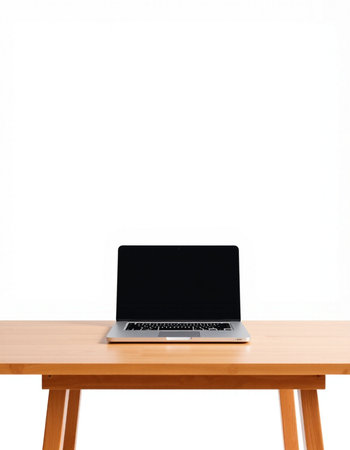 Laptop with blank screen on wooden table isolated on white background.