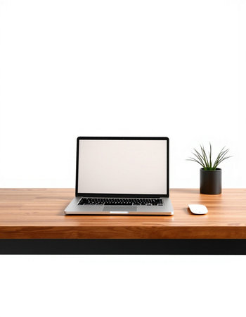 Laptop with blank screen on wooden table isolated on white background.