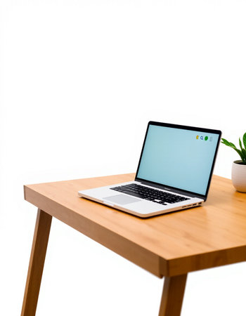 Laptop with blank screen on a wooden table isolated on white background