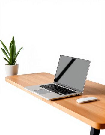 Modern workspace with blank screen laptop computer on wooden table isolated on white backgroundの写真素材