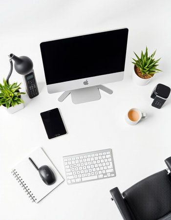 Top view of modern office desk with computer, supplies and coffee cup.の写真素材