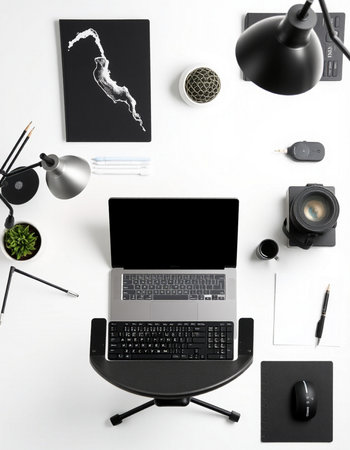 Top view of modern workspace with laptop, stationery and coffee cup on white background
