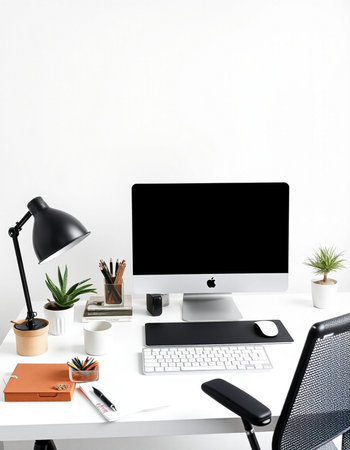 workplace with computer, keyboard, lamp and stationery on white table