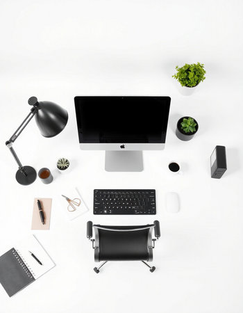Top view of modern workplace with computer, stationery and coffee cup on white backgroundの写真素材