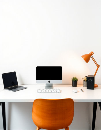 Modern workspace with blank screen computer monitor, laptop and office supplies on white table.の写真素材