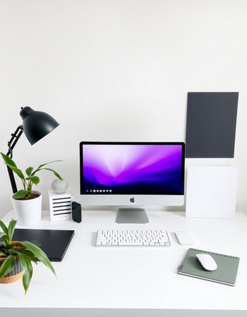 Designer desktop with computer, mouse, keyboard, stationery and plantsの写真素材