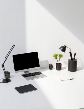 Front view of a modern white office desktop with a computer monitor, a laptop, stationery and a plant. 3d rendering mock upの写真素材