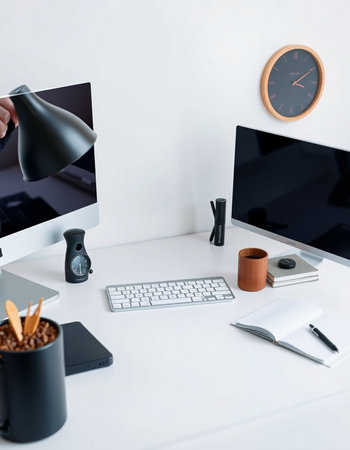 workplace with computer and coffee cup on white table in modern office
