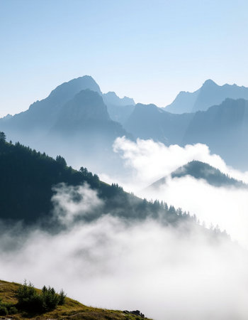 Mountain landscape with fog in the italian dolomites