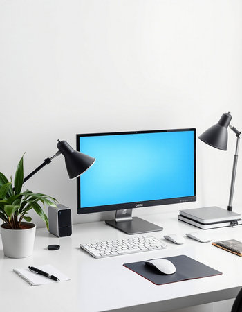 Modern workspace with computer, keyboard, mouse, notebook, lamp and other items