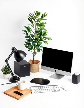 Modern workplace with computer, coffee cup, keyboard and plant on white background