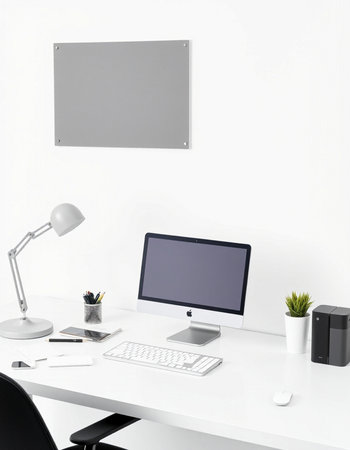 workplace with computer, lamp and stationery on white wall background