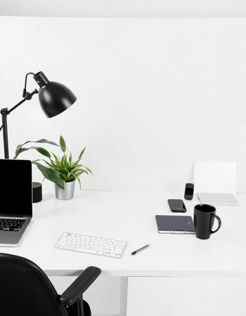 workplace with laptop, coffee cup, stationery and plant on white background