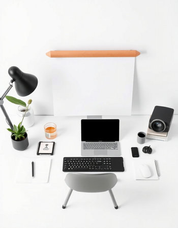 Modern workplace with blank paper, laptop, camera and accessories on white backgroundの写真素材