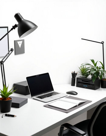 Modern workplace with laptop, tablet and other office supplies on white tableの写真素材