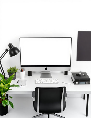 Modern workplace with blank screen on white wall.